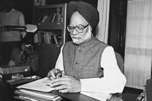 Photos representing economic reforms in the 1990s, such as images of Dr. Manmohan Singh 