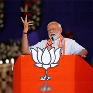 Image of a large BJP rally or Narendra Modi addressing the public