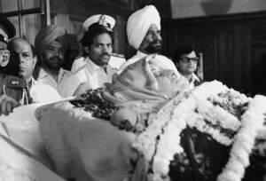 Historical images related to the assassinations of Indira Gandhi and Rajiv Gandhi, including memorials and public mourning.
